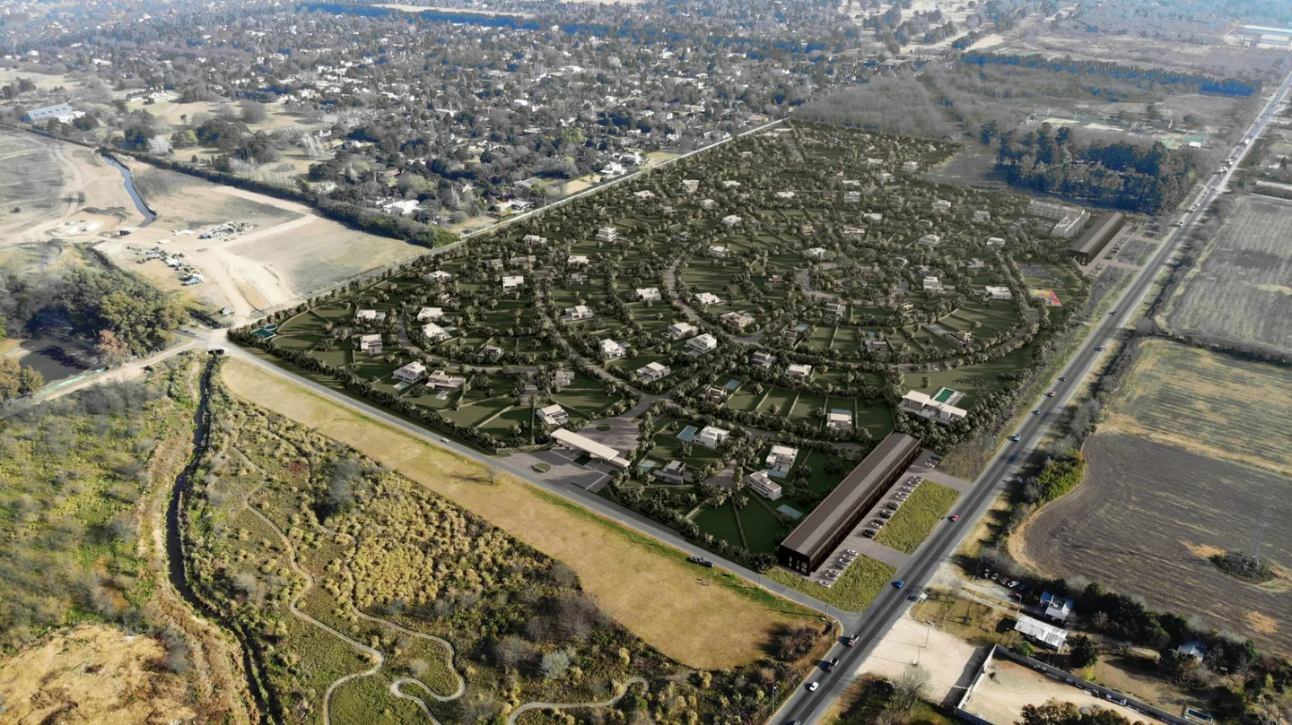 Render aéreo de un desarrollo inmobiliario con viviendas, calles y vegetación